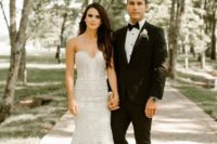 06 a gorgeous lace mermaid wedding gown with a bustier top and a train for a sophisticated bride