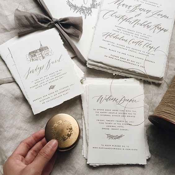 hand painted calligraphy wedding invitation suite is a trendy idea for a modern wedding
