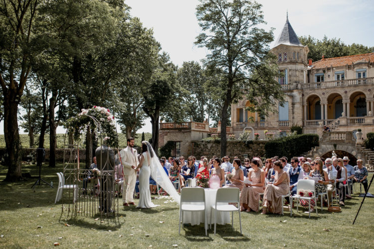 The ceremony took place outdoors, in the gardne of the chateau, with a gorgeous floral arch as decor