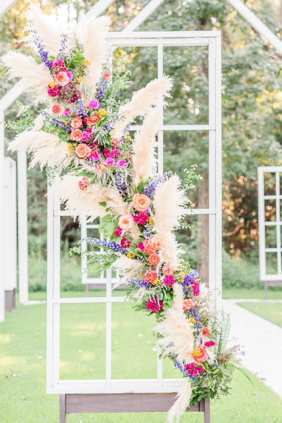 The chapel was also decorated with super bright blooms, greenery and pampas grass