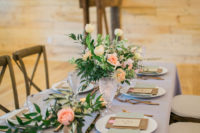 07 The lilac tablecloth, pastel napkins and lush peachy and pink blooms were used to style the table