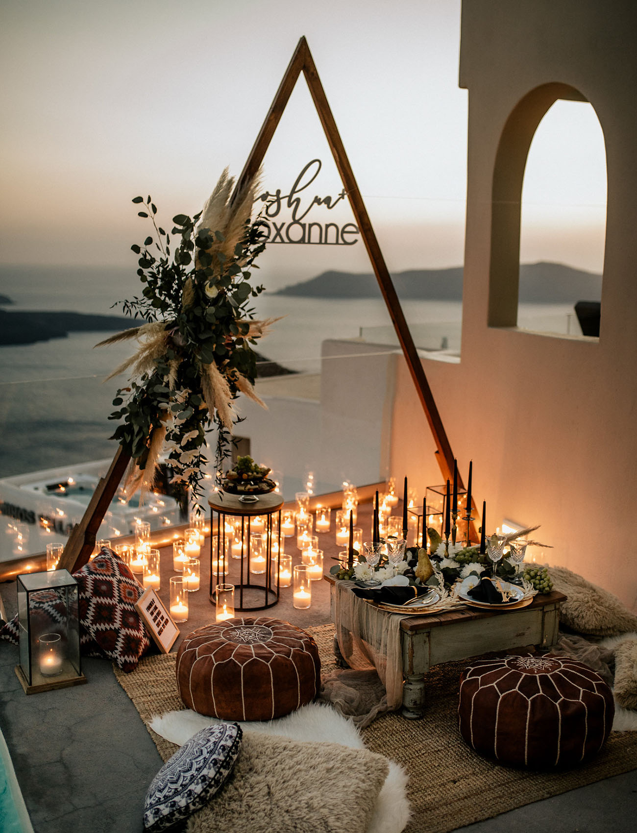 The picnic was overlooking the ocean, filled with candle light, boho rugs, Moroccan ottomans and greenery