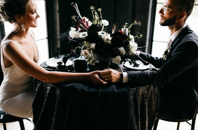The sweetheart table was a moody and exquisite one, with a black sequin tablecloth and a black runner