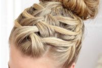 08 a triple French braid with a top knot is a wow idea for a rustic or boho bride