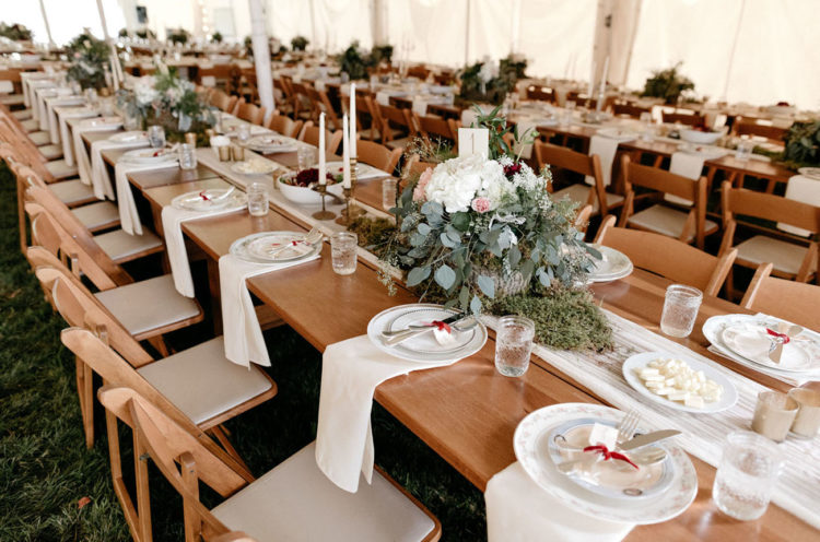 The wedding tablescape was done with neutral textiles, lush blooms and greenery