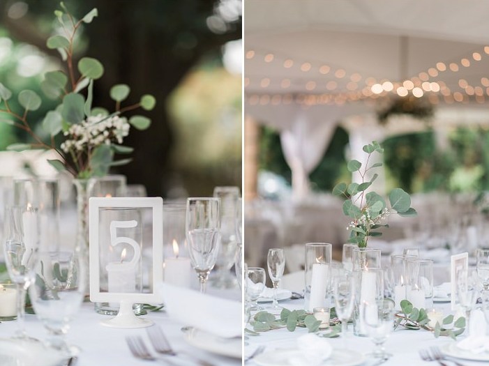 The wedding tablescapes were done with candles and greenery garlands plus centerpieces