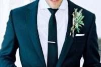 09 a modern black suit, a white shirt and a black tie is classics that will fit many wedding styles