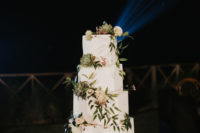 10 The wedding cake was a white one, with faceted sides and much foliage, white blooms and succulents