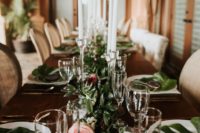 10 The wedding tablescape was done with fresh blooms and greenery and elegant candles