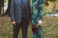 10 a dark green wedding dress with an emerald leaf print and long sleeves and dark green shoes for a fall look