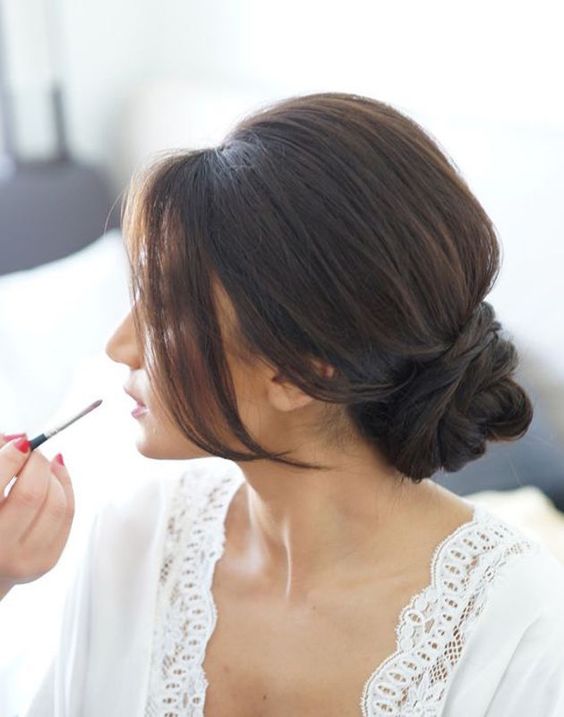 an elegant low bun with a bump and locks down will add chic to your bridal look