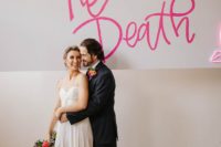 11 A large neon sign in pink was a great idea for a wedding backdrop