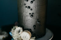 11 The wedding cake was a black metallic one, with black dimensional polka dots, white blooms and macarons
