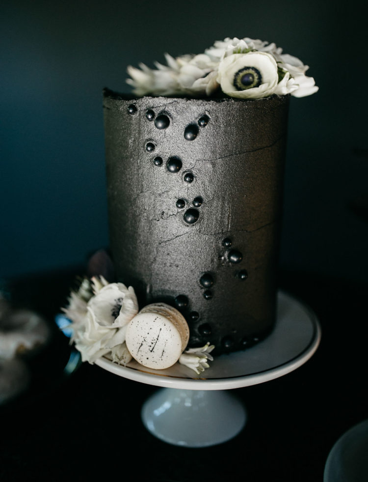 The wedding cake was a black metallic one, with black dimensional polka dots, white blooms and macarons