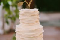 11 a chic white ruffle wedding cake with gold edges and a simple gold heart topper is a cute idea
