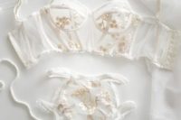 11 a heavenly sheer bridal lingerie set with gold floral lace appliques looks ethereal