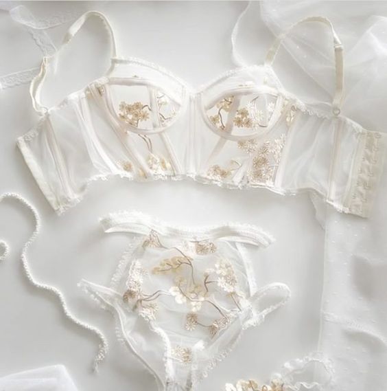 a heavenly sheer bridal lingerie set with gold floral lace appliques looks ethereal