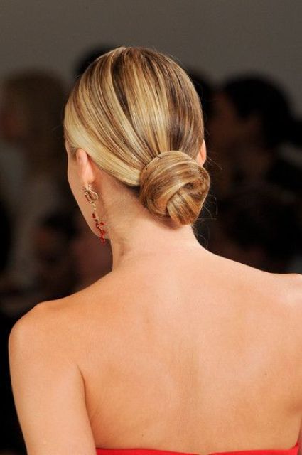 a super sleek and super tight low bun is ideal for a minimalist or modern bride
