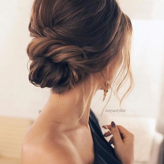a twisted low bun with a bump, some locks down is a classic and very elegant idea