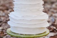 12 a cool white ruffle wedding cake with silver edges and green apples on top for a fall wedding