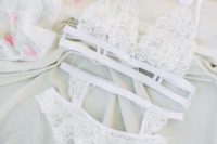 12 a lace bridal lingerie set with a strappy bra, panties and a stocking belt