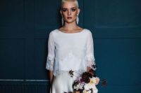 12 a modern bridal look with a white top with lace trim and an off-white silk skirt plus statement earrings