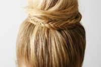 12 a sleek top knot decorated with a fishtail braid is an edgy and cool idea to rock