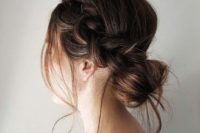 12 an elegant yet messy low bun with a side braid and some locks down for a cool look