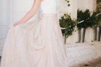 13 a romantic bridal look with a lace strapless top and a blush draped maxi skirt