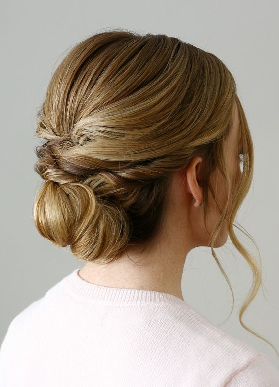a twisted low bun with some locks down plus a bump is a timelessly elegant idea to rock