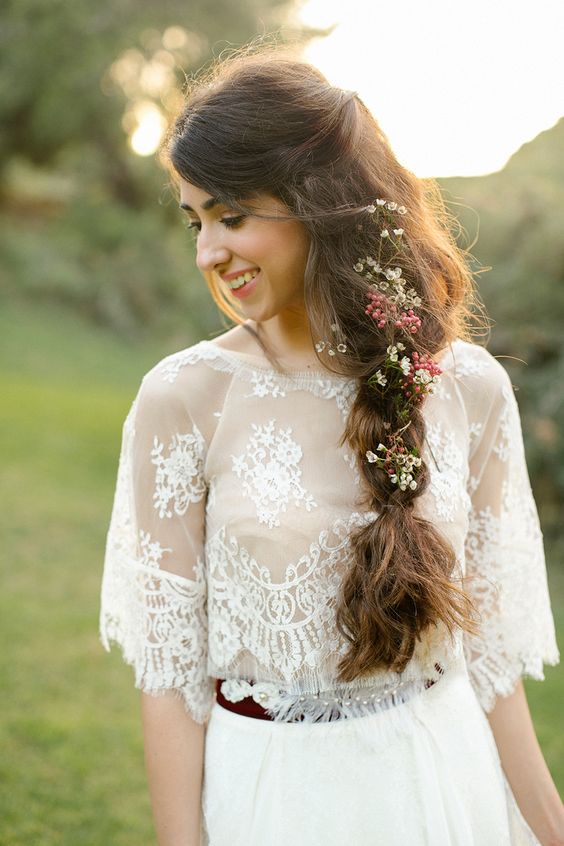 a messy textural twisted braid with some little wildflowers tucked in for a cool look