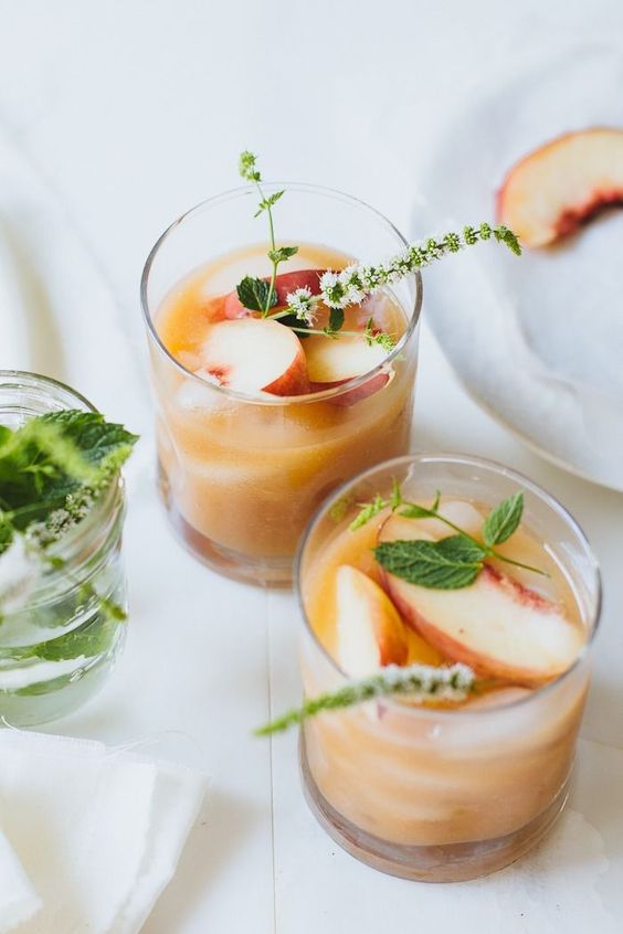 white peach margaritas are great for summer and you may add toppers with leaves and blooms