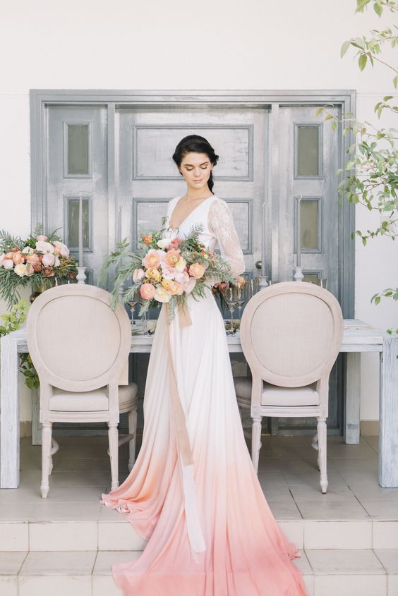 a bold bridal separate with a white lace crop top and a peach ombre A line skirt with a train