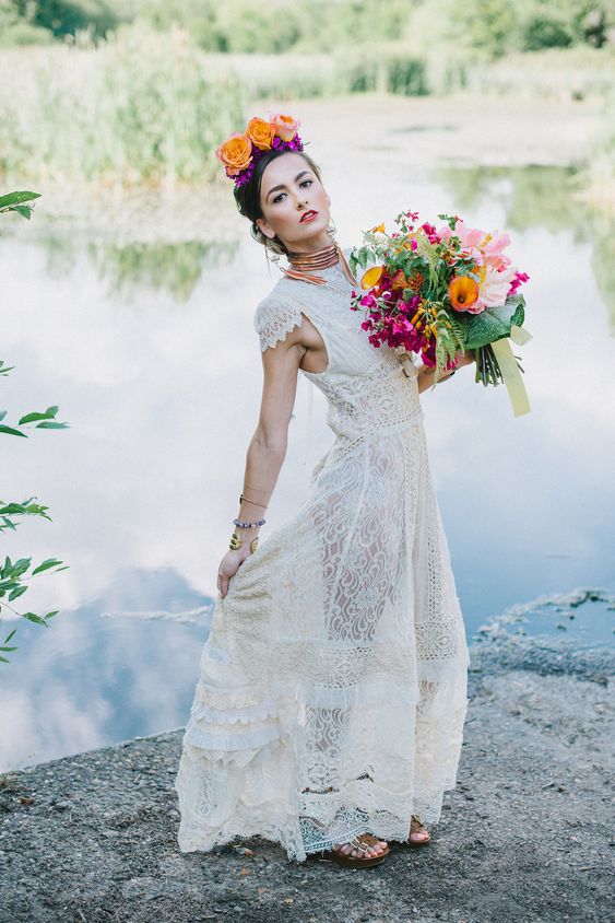a bride wearing an upcycled wedding dress she bought at a thrift store