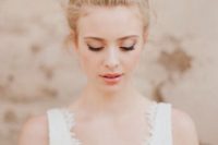 15 a wedding top knot with some loose hair is a chic and effortless hairstyle for a bride