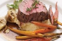 15 filet mignon with mashed potatoes, candied carrots and herbs is an ideal winter main course