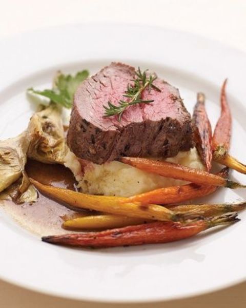 filet mignon with mashed potatoes, candied carrots and herbs is an ideal winter main course