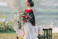 16 a chic bridal spearate with a white lace A-line maxi skirt, a burgundy top with wide sleeves plus statement earrings
