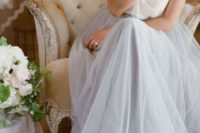 16 a subtle bridal look with a sheer lace top and short sleeves and a grey tulle maxi skirt