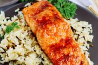 16 apricot glazed salmon served with rice and fresh herbs as an alternative to meat