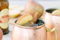 17 signature fall cocktails with apples and cinnamon served in copper mugs