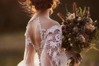 18 a low braided and twisted updo with herbs and blooms is a great idea for a boho bride