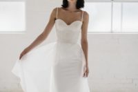 19 a bustier sheath wedding dress on straps with a lace bodice, a plain skirt and an airy overskirt