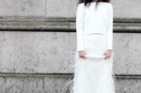 19 a plain white long sleeve top and a maxi white ostrich skirt for a modern bride