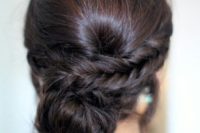 20 a low bun with a side braid and a bump for a whimsy take on a usual low bun hairstyle