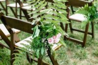 20 decorate chairs of the wedding aisle with ferns and pink roses to make the aisle naturally cool