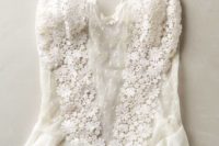 21 a romantic white bodysuit with ruffles, lace appliques and sheer parts