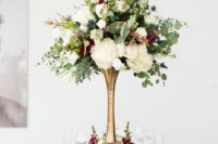21 an elegant wedding centerpiece of white, burgundy blooms, thistles and eucalyptus in a brass tall vase