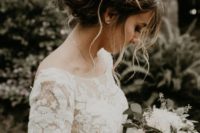 22 a messy twisted and braided updo with a braided halo and some curls down for a boho bride