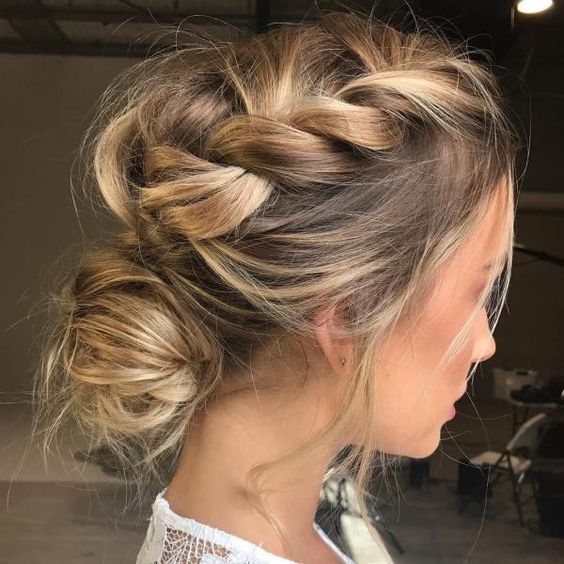 a super messy braid on top plus a messy low bun for an ultimate boho chic wedding hairstyle